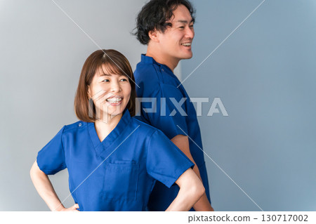 Medical workers in scrubs, medical staff, male and female doctors Medical workers in scrubs, medical staff, male and female doctors 130717002