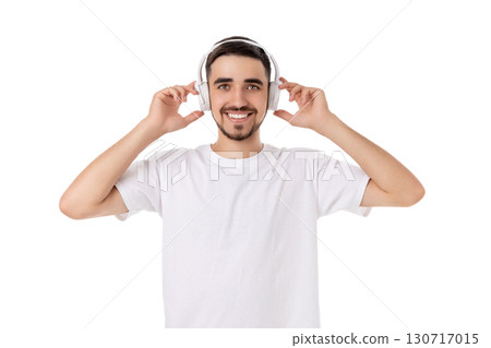Man joyfully interacts with headphones, isolated, PNG 130717015