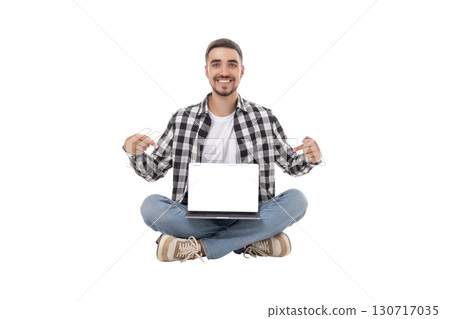 Young man showcases modern gadget while sitting relaxed, isolated, PNG Young man showcases modern gadget while sitting relaxed, isolated, PNG 130717035