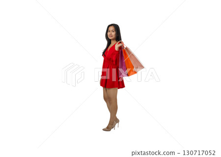 Woman enjoys shopping while holding colorful bags, isolated, PNG Woman enjoys shopping while holding colorful bags, isolated, PNG 130717052
