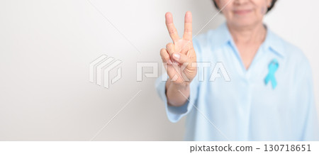 Elderly with blue Ribbon for concept of blue November, November Prostate Cancer Awareness month, World Diabetes day , Men Health month, International men, Father day. Healthcare and world cancer day 130718651