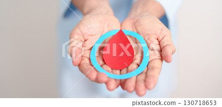 Elderly woman with Blue Circle and red Blood drop for World Diabetes Day, Blue November Health month, Diabetes awareness, Blood sugar check, Insulin, Glucose screening, donation and Health checkup 130718653