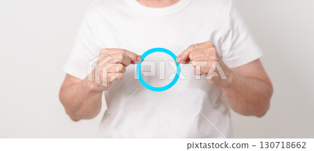 Elderly woman with Blue Circle for World Diabetes Day, Blue November Health month, Diabetes awareness, Blood sugar check, Insulin, Glucose screening, Healthy lifestyle, Chronic disease checkup Elderly woman with Blue Circle for World Diabetes Day, Blue November Health month, Diabetes awareness, Blood sugar check, Insulin, Glucose screening, Healthy lifestyle, Chronic disease checkup 130718662