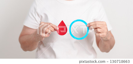 Elderly woman with Blue Circle and red Blood drop for World Diabetes Day, Blue November Health month, Diabetes awareness, Blood sugar check, Insulin, Glucose screening, donation and Health checkup Elderly woman with Blue Circle and red Blood drop for World Diabetes Day, Blue November Health month, Diabetes awareness, Blood sugar check, Insulin, Glucose screening, donation and Health checkup 130718663