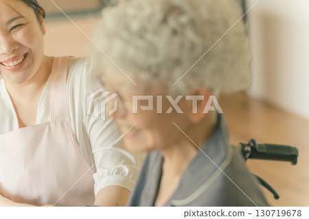Elderly people and caregivers 130719678
