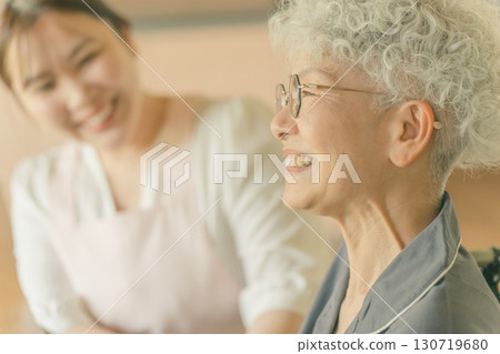 Elderly people and caregivers 130719680
