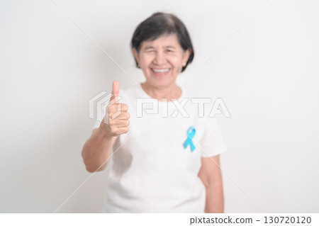Elderly with blue Ribbon for concept of blue November, November Prostate Cancer Awareness month, World Diabetes day , Men Health month, International men, Father day. Healthcare and world cancer day Elderly with blue Ribbon for concept of blue November, November Prostate Cancer Awareness month, World Diabetes day , Men Health month, International men, Father day. Healthcare and world cancer day 130720120