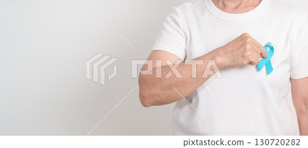 Elderly with blue Ribbon for concept of blue November, November Prostate Cancer Awareness month, World Diabetes day , Men Health month, International men, Father day. Healthcare and world cancer day 130720282