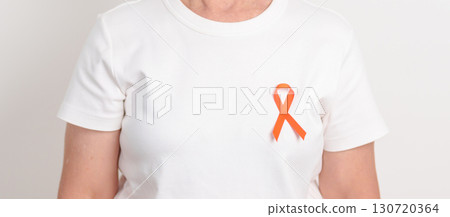 Elderly with Orange Ribbon for September Leukemia, March Kidney cancer day, Multiple Sclerosis, November Complex Regional Pain Syndrome, CRPS, COPD, Chronic Obstructive Pulmonary disease concepts 130720364
