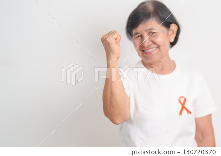 Elderly with Orange Ribbon for September Leukemia, March Kidney cancer day, Multiple Sclerosis, November Complex Regional Pain Syndrome, CRPS, COPD, Chronic Obstructive Pulmonary disease concepts 130720370