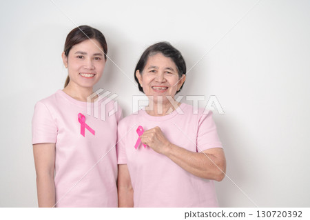 Couple woman with pink Ribbon for Pink October Breast Cancer Awareness month, May Women Health, November Birth Parents Adoption, women rights, Empowerment, March International Women day and Cancer day 130720392