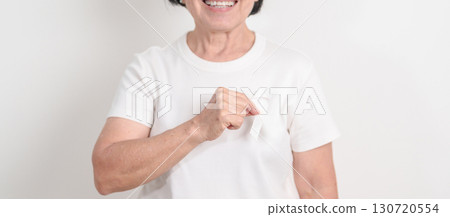 Elderly with White ribbon for concept November Lung Cancer Awareness month, Stop Violence Against Women, Adoption, May Retinoblastoma, Action for Women Health, March Remembrance, October Osteoporosis 130720554