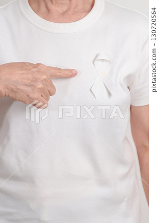 Elderly with White ribbon for concept November Lung Cancer Awareness month, Stop Violence Against Women, Adoption, May Retinoblastoma, Action for Women Health, March Remembrance, October Osteoporosis Elderly with White ribbon for concept November Lung Cancer Awareness month, Stop Violence Against Women, Adoption, May Retinoblastoma, Action for Women Health, March Remembrance, October Osteoporosis 130720564