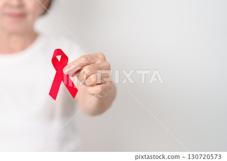 Elderly with Red Ribbon for December World Aids Day, MADD, October Red ribbon week, February Heart month, Marfan Syndrome, May Stroke awareness, March world TB Tuberculosis day and April Dare day Elderly with Red Ribbon for December World Aids Day, MADD, October Red ribbon week, February Heart month, Marfan Syndrome, May Stroke awareness, March world TB Tuberculosis day and April Dare day 130720573