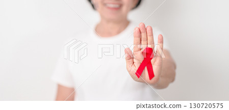 Elderly with Red Ribbon for December World Aids Day, MADD, October Red ribbon week, February Heart month, Marfan Syndrome, May Stroke awareness, March world TB Tuberculosis day and April Dare day 130720575