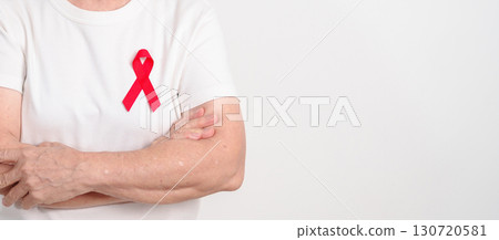 Elderly with Red Ribbon for December World Aids Day, MADD, October Red ribbon week, February Heart month, Marfan Syndrome, May Stroke awareness, March world TB Tuberculosis day and April Dare day 130720581