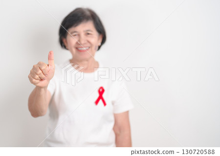 Elderly with Red Ribbon for December World Aids Day, MADD, October Red ribbon week, February Heart month, Marfan Syndrome, May Stroke awareness, March world TB Tuberculosis day and April Dare day Elderly with Red Ribbon for December World Aids Day, MADD, October Red ribbon week, February Heart month, Marfan Syndrome, May Stroke awareness, March world TB Tuberculosis day and April Dare day 130720588