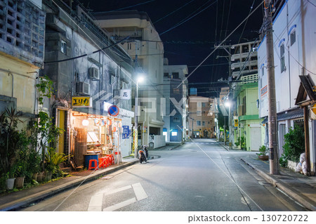 The quaint exterior features neon lights. An outdoor counter with old scooters and other items. Enjoy a late-night drink in Okinawa's largest entertainment district. The quaint exterior features neon lights. An outdoor counter with old scooters and other items. Enjoy a late-night drink in Okinawa's largest entertainment district. 130720722