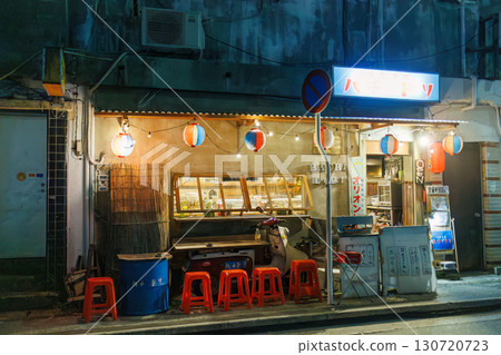 The quaint exterior features neon lights. An outdoor counter with old scooters and other items. Enjoy a late-night drink in Okinawa's largest entertainment district. The quaint exterior features neon lights. An outdoor counter with old scooters and other items. Enjoy a late-night drink in Okinawa's largest entertainment district. 130720723