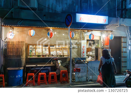 The quaint exterior features neon lights. An outdoor counter with old scooters and other items. Enjoy a late-night drink in Okinawa's largest entertainment district. The quaint exterior features neon lights. An outdoor counter with old scooters and other items. Enjoy a late-night drink in Okinawa's largest entertainment district. 130720725