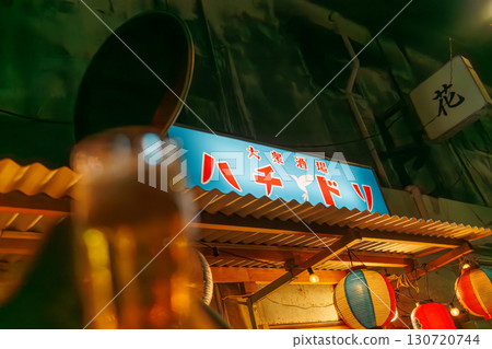 The quaint exterior features neon lights. An outdoor counter with old scooters and other items. Enjoy a late-night drink in Okinawa's largest entertainment district. The quaint exterior features neon lights. An outdoor counter with old scooters and other items. Enjoy a late-night drink in Okinawa's largest entertainment district. 130720744