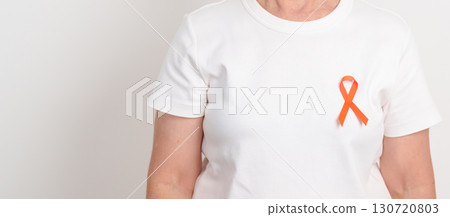 Elderly with Orange Ribbon for Leukemia, Kidney cancer day, Multiple Sclerosis, Self Injury Awareness month, Hunger action, Complex Regional Pain Syndrome, Gun Violence, Agent Orange, Work Zone safety 130720803