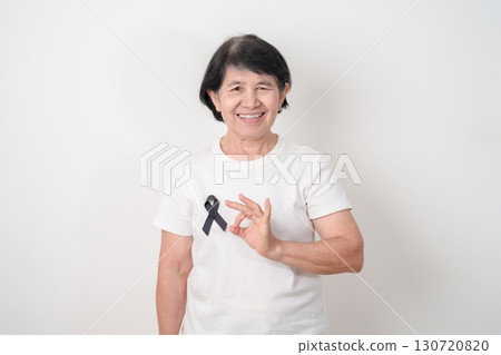 Elderly with Black ribbon for May Melanoma and skin cancer Awareness month, October Vaccine injury awareness month, Mourning Remembrance, March Sleep awareness week, Gang Prevention and Anti Violence Elderly with Black ribbon for May Melanoma and skin cancer Awareness month, October Vaccine injury awareness month, Mourning Remembrance, March Sleep awareness week, Gang Prevention and Anti Violence 130720820