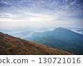 Landscape of Morning Mist with Mountain Layer. mountain ridge and clouds in rural jungle bush forest 130721016