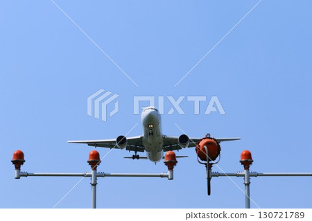 Aircraft taking off and landing 130721789