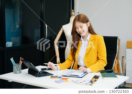 Young woman running online store Startup small business SME, using smartphone or tablet taking receive and checking Young woman running online store Startup small business SME, using smartphone or tablet taking receive and checking 130722303