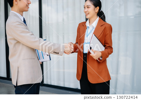 Business partnership handshake concept.Photo two coworkers handshaking process. 130722414