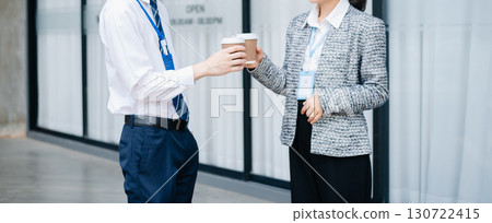 Business partnership handshake concept.Photo two coworkers handshaking process. Business partnership handshake concept.Photo two coworkers handshaking process. 130722415