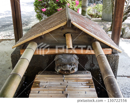 Shishiguchi (lion's mouth) at the Chozuya (purification fountain) at Tachiki Shrine Shishiguchi (lion's mouth) at the Chozuya (purification fountain) at Tachiki Shrine 130722556