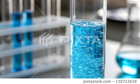 Bubbling blue liquid in a laboratory test tube during a science experiment 130722638