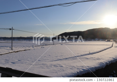 Snowfield lit by the setting sun Snowfield lit by the setting sun 130722861