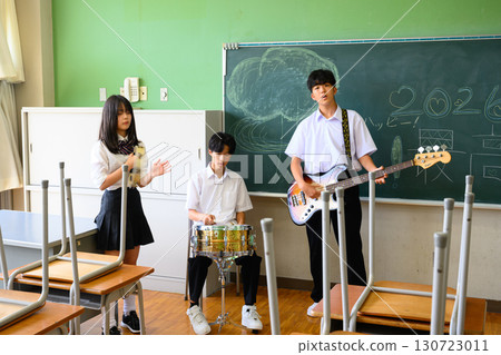 Students practicing in a band for the school festival. A youthful image in a school classroom. Students practicing in a band for the school festival. A youthful image in a school classroom. 130723011