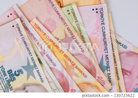Several Turkish lira cash banknotes of different denominations are displayed, highlighting 130723622