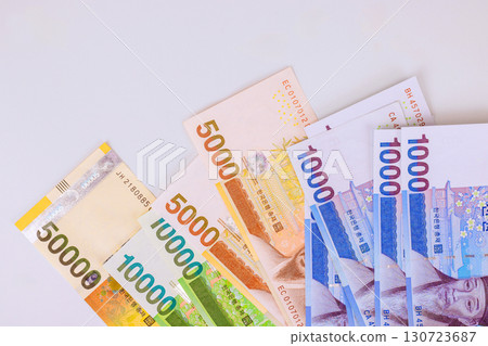 South Korean won cash banknotes are arranged on alight background South Korean won cash banknotes are arranged on alight background 130723687