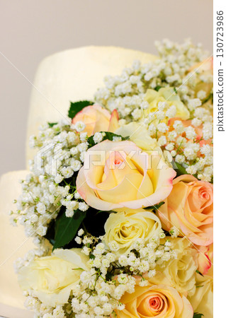 Stunning arrangement features soft pastel roses baby breath, perfect for celebrations or special events. 130723986