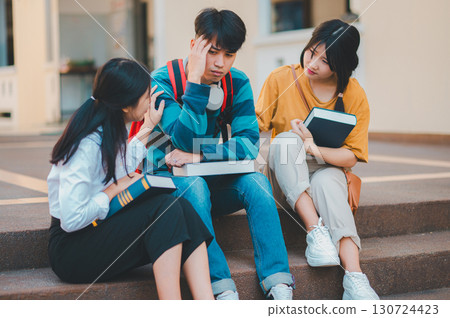 Fellow students are consoling friends who are disappointed in grades, frustrated with tasks that are not meeting their goals, helping each other. Fellow students are consoling friends who are disappointed in grades, frustrated with tasks that are not meeting their goals, helping each other. 130724423