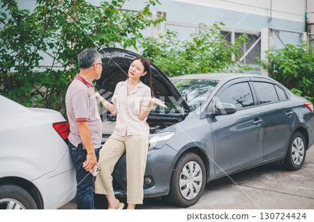 parties are quarreling due to a car accident while waiting for the insurance agent to clear it. parties are quarreling due to a car accident while waiting for the insurance agent to clear it. 130724424