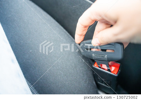 Artificial seat belt plug.Violation of traffic rules. Irresponsible driving and behavior concept 130725002