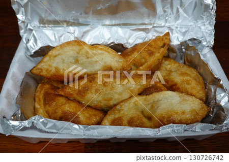 Steamed or fried Korean mandu dumplings filled with a savory mix of meat and vegetables. Crispy on the outside, tender on the inside. perfect for dipping in soy sauce or chili oil! Steamed or fried Korean mandu dumplings filled with a savory mix of meat and vegetables. Crispy on the outside, tender on the inside. perfect for dipping in soy sauce or chili oil! 130726742