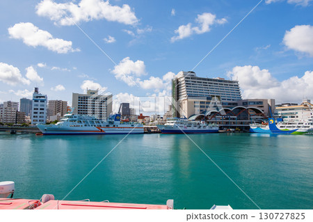 A view of Naha Tomari Port from a departing ship. Tomari Bridge and Tomarin are visible. Naha Tomari Port, Naha City, Okinawa Prefecture - June 26, 2025 130727825