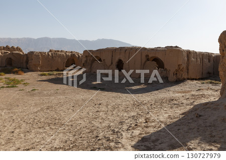 Ancient mud brick city ruins in the desert of Balkh Province with mountains in the background Ancient mud brick city ruins in the desert of Balkh Province with mountains in the background 130727979