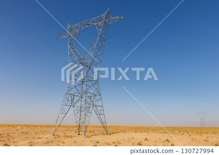 High voltage electricity pylon in the remote desert landscape of rural Afghanistan on a sunny day 130727994