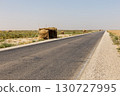 Rural roadside stalls made of straw on a highway in the desert landscape of Jowzjan Afghanistan 130727995