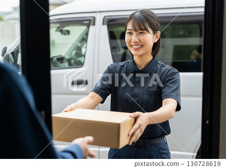 Delivery staff delivering packages with a smile: A delivery service that gives customers peace of mind 130728619