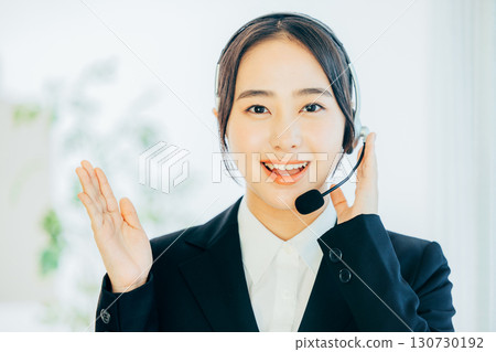 Female operator with white background 130730192