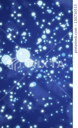 Soft glowing blue bokeh lights scattered across a deep blue background, creating a dreamy night atmosphere 130730515
